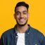 Smiling Middle Eastern Man In Casual With Laptop Y9ey47v.jpg